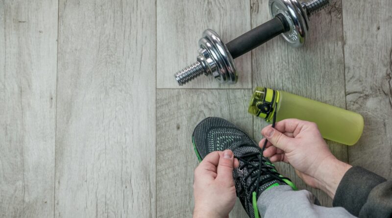 a person working on a pair of running shoes